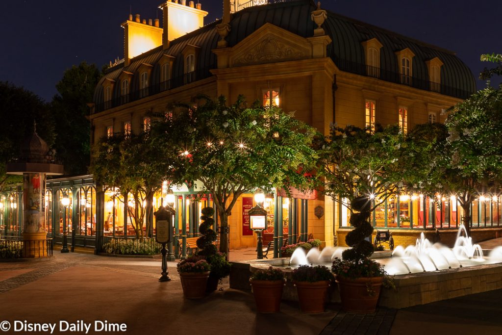 Exterior view of Chefs de France in Epcot at night.