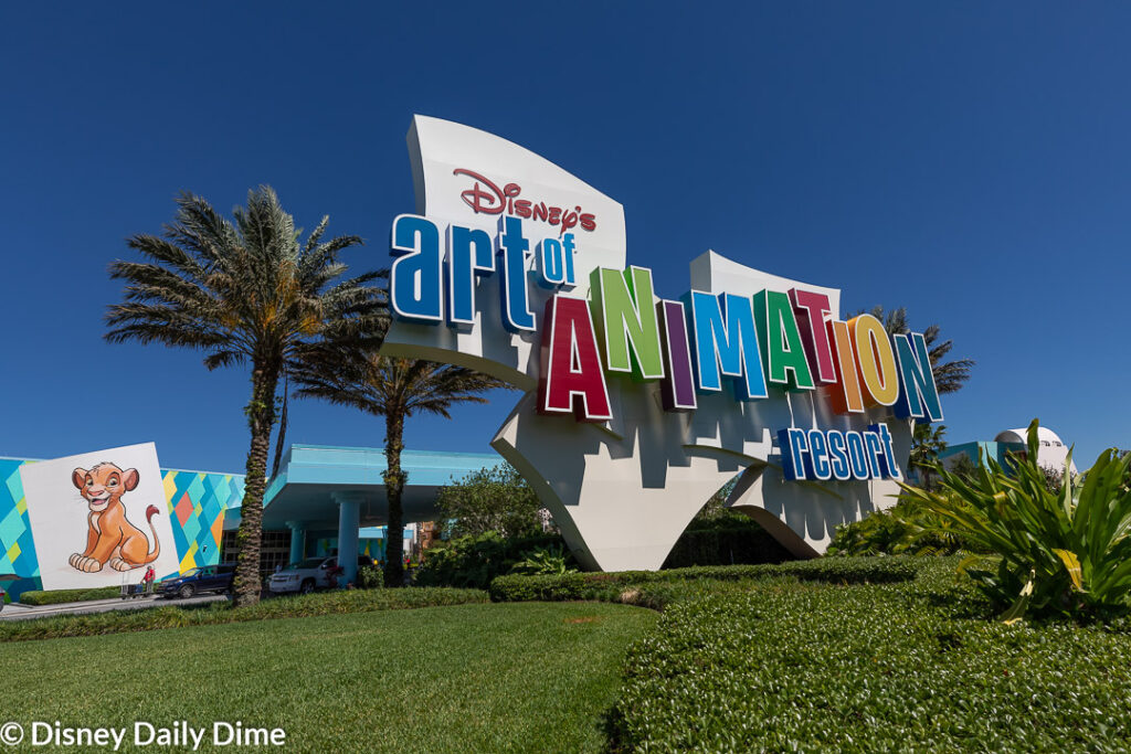 This image shows the sign leading to the entrance of Disney's Art of Animation Resort.