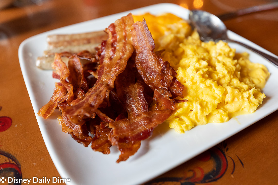 The plat features eggs, bacon, sausage, and potato cassarole.